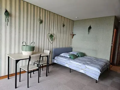 Un ou plusieurs lits dans un hébergement de l'établissement LE PANORAMA studio privé avec vue magnifique TURCKHEIM TROIS ÉPIS