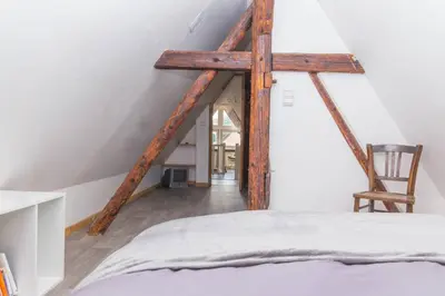 Un ou plusieurs lits dans un hébergement de l'établissement charmant appartement alsacien