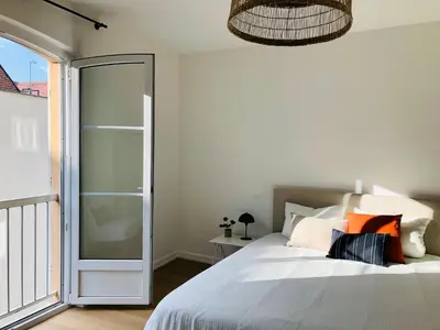 Un ou plusieurs lits dans un hébergement de l'établissement Appartement Coeur de Ville Cathédrale - Ascenseur -