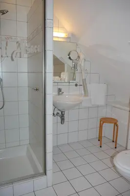 Salle de bains dans l'établissement Hôtel sud alsace