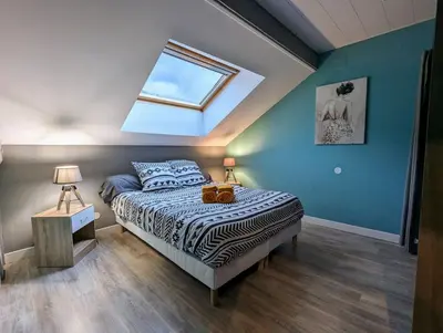 Un ou plusieurs lits dans un hébergement de l'établissement Maison Gite Le Bressaud