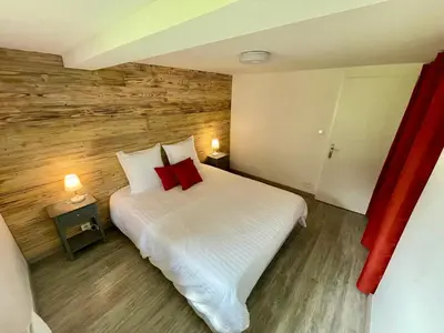 Un ou plusieurs lits dans un hébergement de l'établissement Chalet Le Cèdre Bleu 10 p - 10 min de Gérardmer