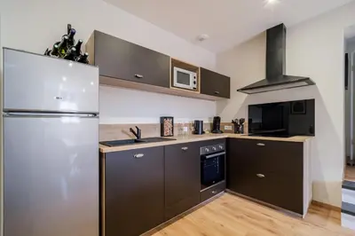 Cuisine ou kitchenette dans l'établissement Le Caveau de Sigo