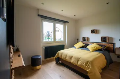 Un ou plusieurs lits dans un hébergement de l'établissement Gîte au coeur de l'Alsace Maison Gatsby
