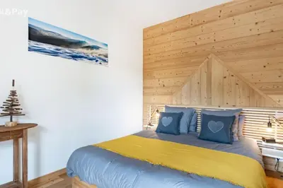 Un ou plusieurs lits dans un hébergement de l'établissement Appartement Maïnou à La Bresse