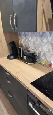 Cuisine ou kitchenette dans l'établissement Résidence cosy et moderne