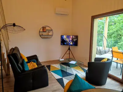 Coin salon dans l'établissement Alsace Chalet & Spa Meyer-Krumb