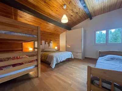 Un ou plusieurs lits dans un hébergement de l'établissement CHALET DES HAUTS SAPINS LA BRESSE