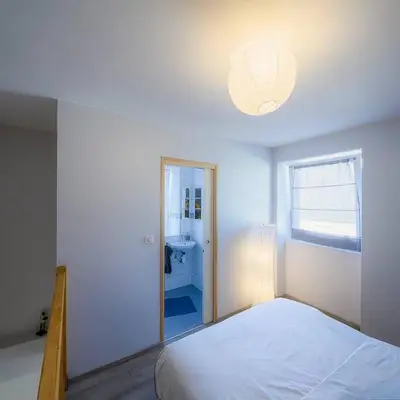 Un ou plusieurs lits dans un hébergement de l'établissement Cosy duplex indépendant