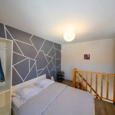 Un ou plusieurs lits dans un hébergement de l'établissement Cosy duplex indépendant