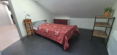 Un ou plusieurs lits dans un hébergement de l'établissement Cramiland - Appart complet chez nous