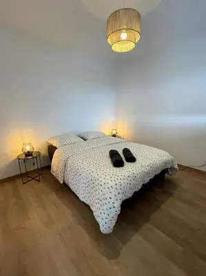 Un ou plusieurs lits dans un hébergement de l'établissement Magnifique appartement à la frontière suisse