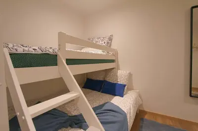 Un ou plusieurs lits dans un hébergement de l'établissement Maison cossue, moderne et calme à La Bresse 5 chbr