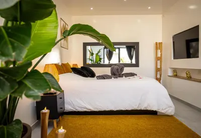 Un ou plusieurs lits dans un hébergement de l'établissement Gîte Spa Cookie