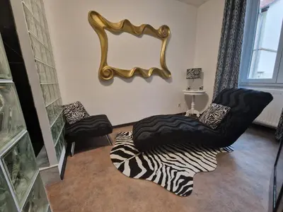 Coin salon dans l'établissement Suite GOLD Mulhouse