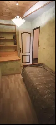 Un ou plusieurs lits dans un hébergement de l'établissement Appartement au pied du château
