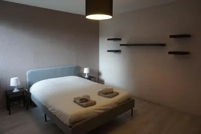 Un ou plusieurs lits dans un hébergement de l'établissement L'Aubach - appartement spacieux - au pied du vignoble - parking gratuit