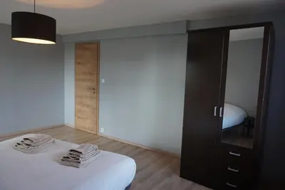 Un ou plusieurs lits dans un hébergement de l'établissement L'Aubach - appartement spacieux - au pied du vignoble - parking gratuit