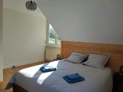 Un ou plusieurs lits dans un hébergement de l'établissement Le spitzacker gîte familial au calme