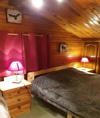 Un ou plusieurs lits dans un hébergement de l'établissement Chalet le Grand Tétras