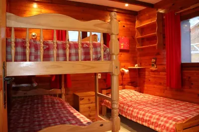Un ou plusieurs lits dans un hébergement de l'établissement Chalet le Grand Tétras