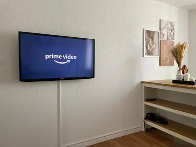 Télévision ou salle de divertissement dans l'établissement Appartement la petite Venise