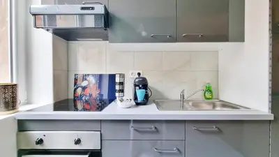Cuisine ou kitchenette dans l'établissement La Résidence Évasion 1 - Original - Gare - Wifi - Relax BNB