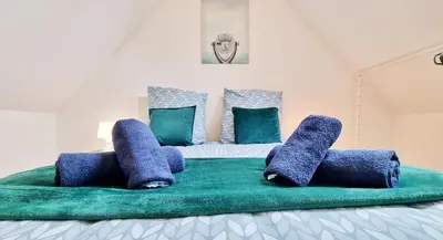 Un ou plusieurs lits dans un hébergement de l'établissement Le Triplex - 5 chambres - 10 pers- Fibre - Relax BNB