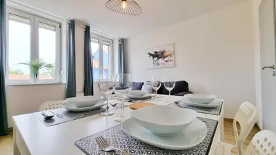Coin salon dans l'établissement Le Triplex - 5 chambres - 10 pers- Fibre - Relax BNB