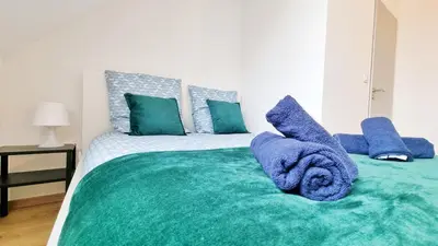 Un ou plusieurs lits dans un hébergement de l'établissement Le Triplex - 5 chambres - 10 pers- Fibre - Relax BNB