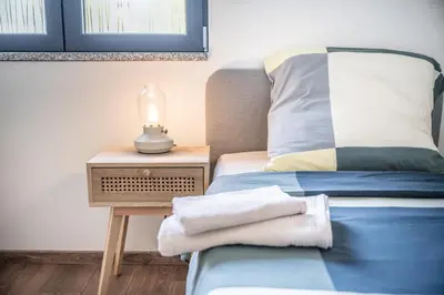 Un ou plusieurs lits dans un hébergement de l'établissement Appartement l'Eden