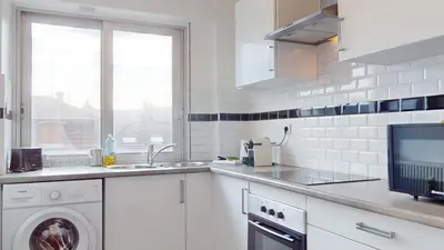 Cuisine ou kitchenette dans l'établissement Appartement La Fecht + parking