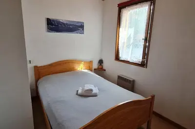 Un ou plusieurs lits dans un hébergement de l'établissement Gîte Le Bressaud