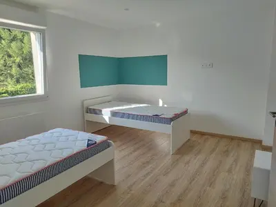 Un ou plusieurs lits dans un hébergement de l'établissement Gîte l'harmonie I