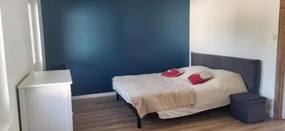 Un ou plusieurs lits dans un hébergement de l'établissement Magnifique appartement le marronnier