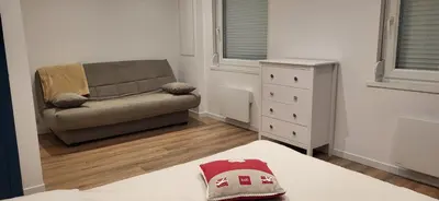 Coin salon dans l'établissement Magnifique appartement le marronnier