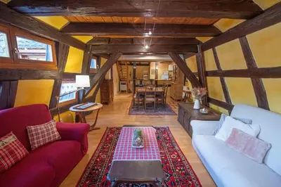 Coin salon dans l'établissement Les Gîtes Coeur de Vigne