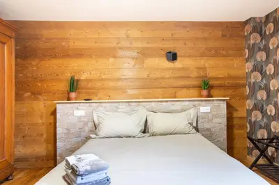 Un ou plusieurs lits dans un hébergement de l'établissement Appartement 12 personnes 4 suite privatives 160 m2 terrasse