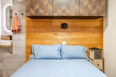 Un ou plusieurs lits dans un hébergement de l'établissement Appartement 12 personnes 4 suite privatives 160 m2 terrasse