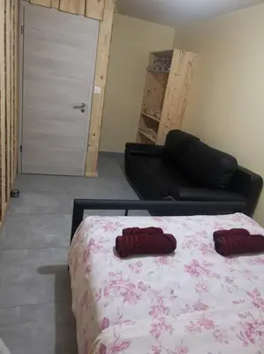 Un ou plusieurs lits dans un hébergement de l'établissement Belle appartement style chalet