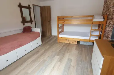 Un ou plusieurs lits dans un hébergement de l'établissement Appartement Cosy Le Renne Des Neiges Vue montagne