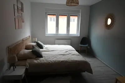 Un ou plusieurs lits dans un hébergement de l'établissement Chez Sim et Vava