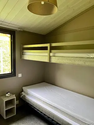 Un ou plusieurs lits dans un hébergement de l'établissement Le Chalet de la Folie