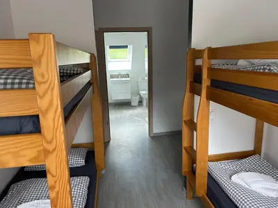 Un ou plusieurs lits dans un hébergement de l'établissement Auberge du Graber