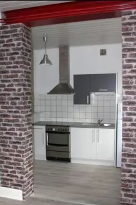 Cuisine ou kitchenette dans l'établissement Agréable F3 - RDC (2 chambres)