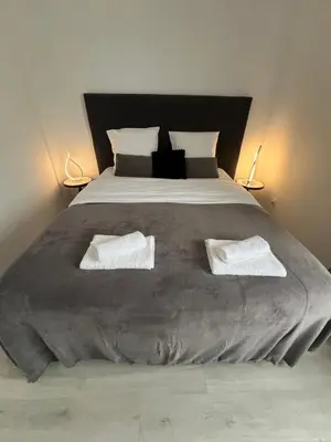 Un ou plusieurs lits dans un hébergement de l'établissement Le Cannois, Appartement de star 3 chambres