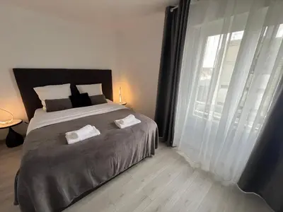 Un ou plusieurs lits dans un hébergement de l'établissement Le Cannois, Appartement de star 3 chambres