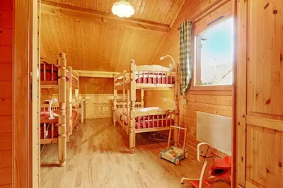 Un ou plusieurs lits dans un hébergement de l'établissement Le Chalet des Cœurs - Avec vue montagne