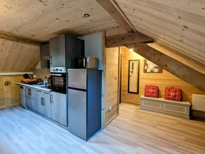 Cuisine ou kitchenette dans l'établissement LE GRENIER