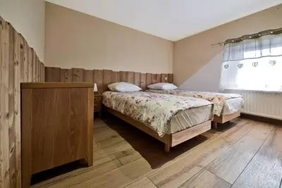 Un ou plusieurs lits dans un hébergement de l'établissement Gîte la Croisée Pierre